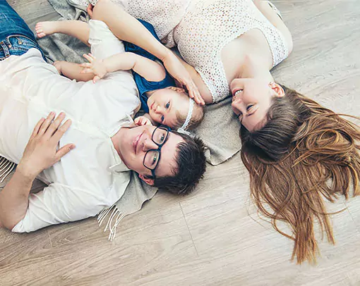 Happy family on laminate | PriceCo Floors